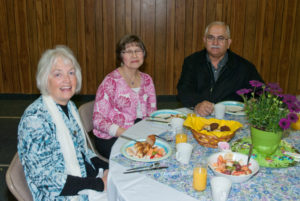 Easter Breakfast - Church Members Sitting Around Table