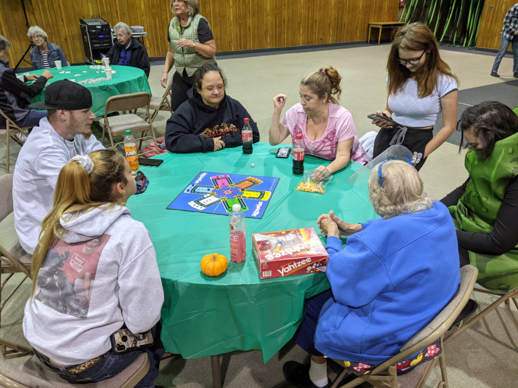 Group of church members play a board game